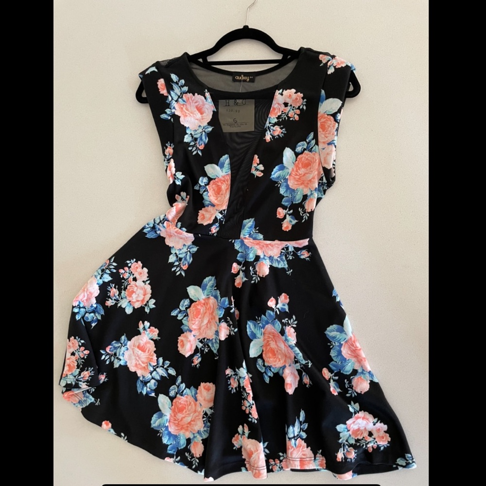 Black dress with floral design and mesh peekaboos